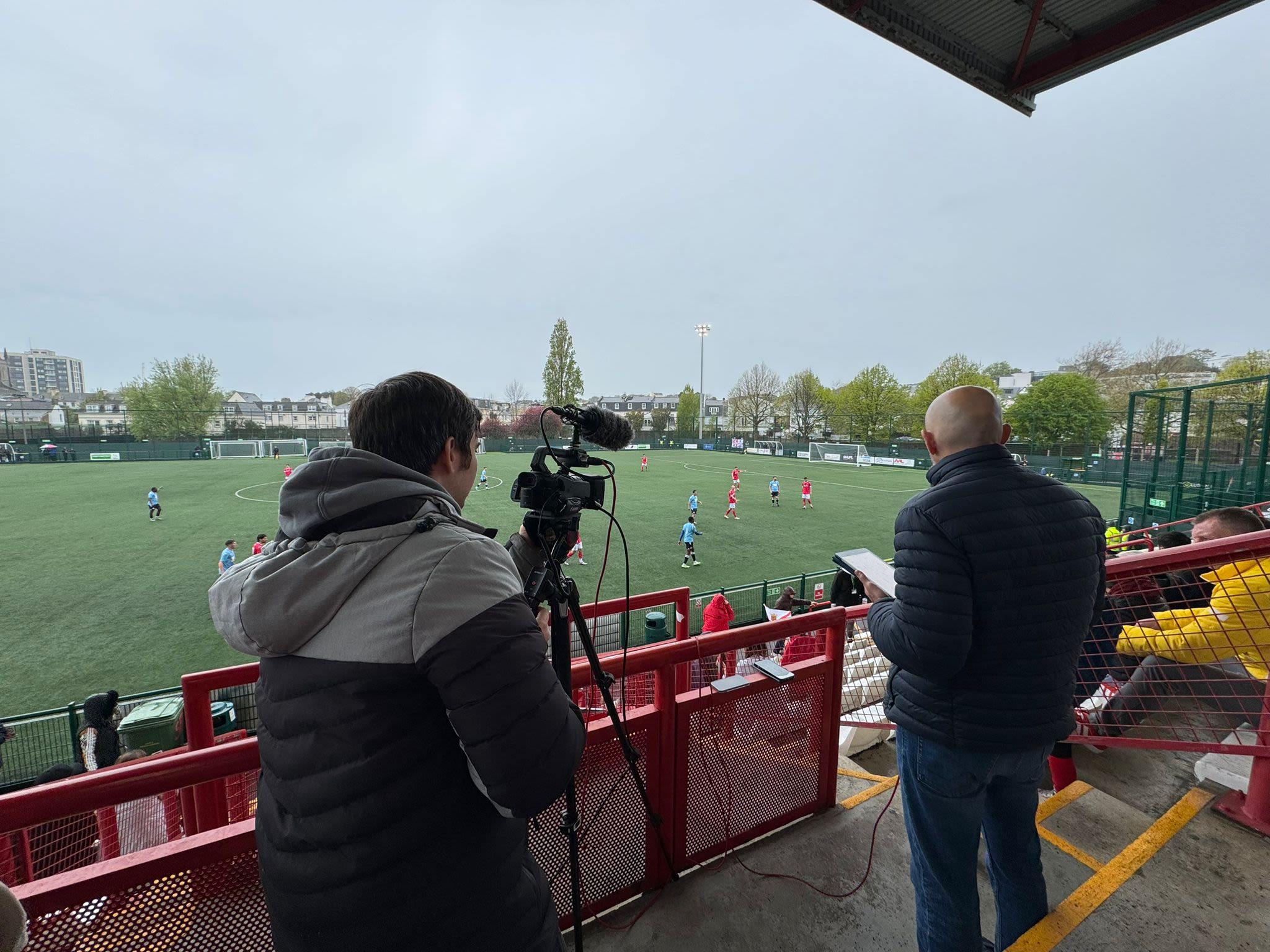 Media team set up the camera ahead of a live matchday broadcast.