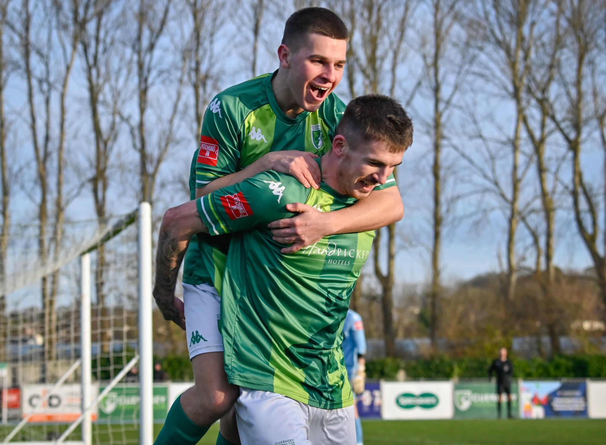 Guernsey FC players celebrate.