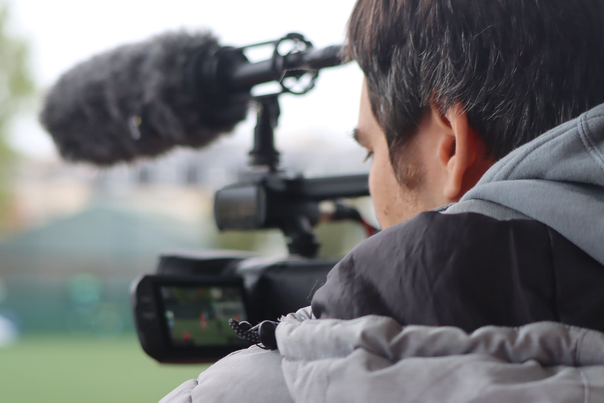 Close-up shot of Ed Peck refining the camera at Springfield Stadium.