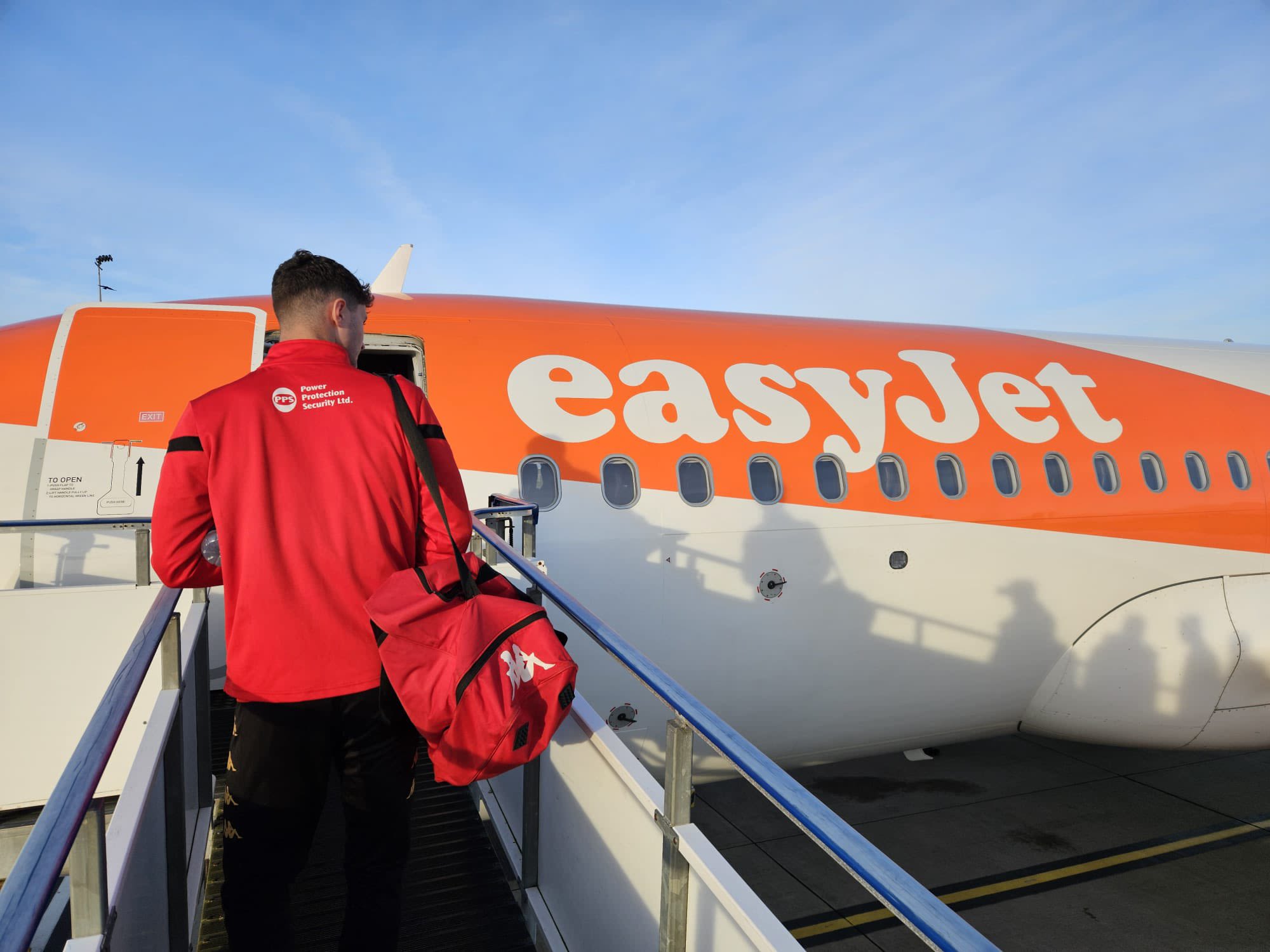 Jersey Bulls squad boarding a plane en-route to an away fixture.