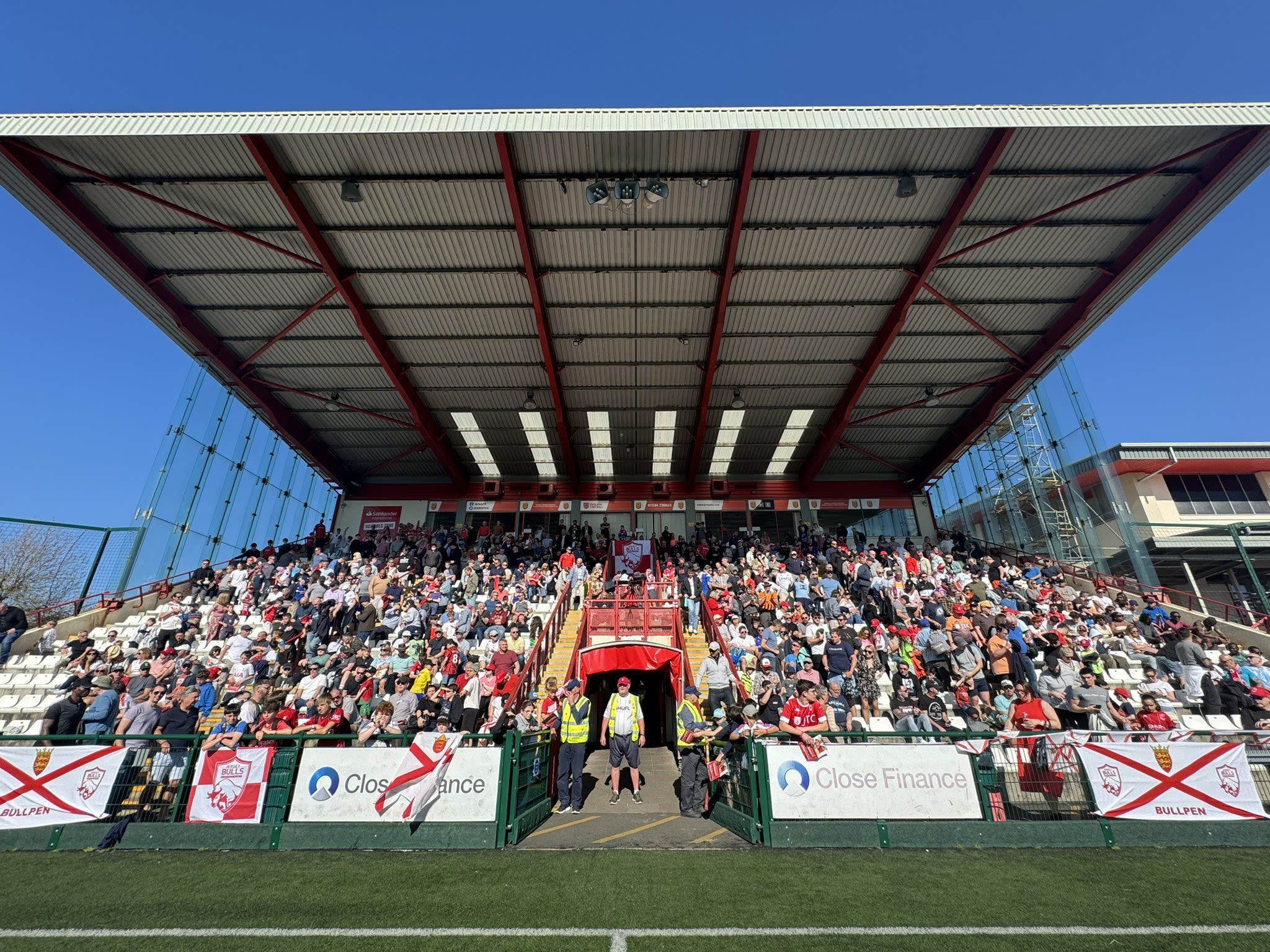 Pitchside view of the main stand at Springfield Stadium.