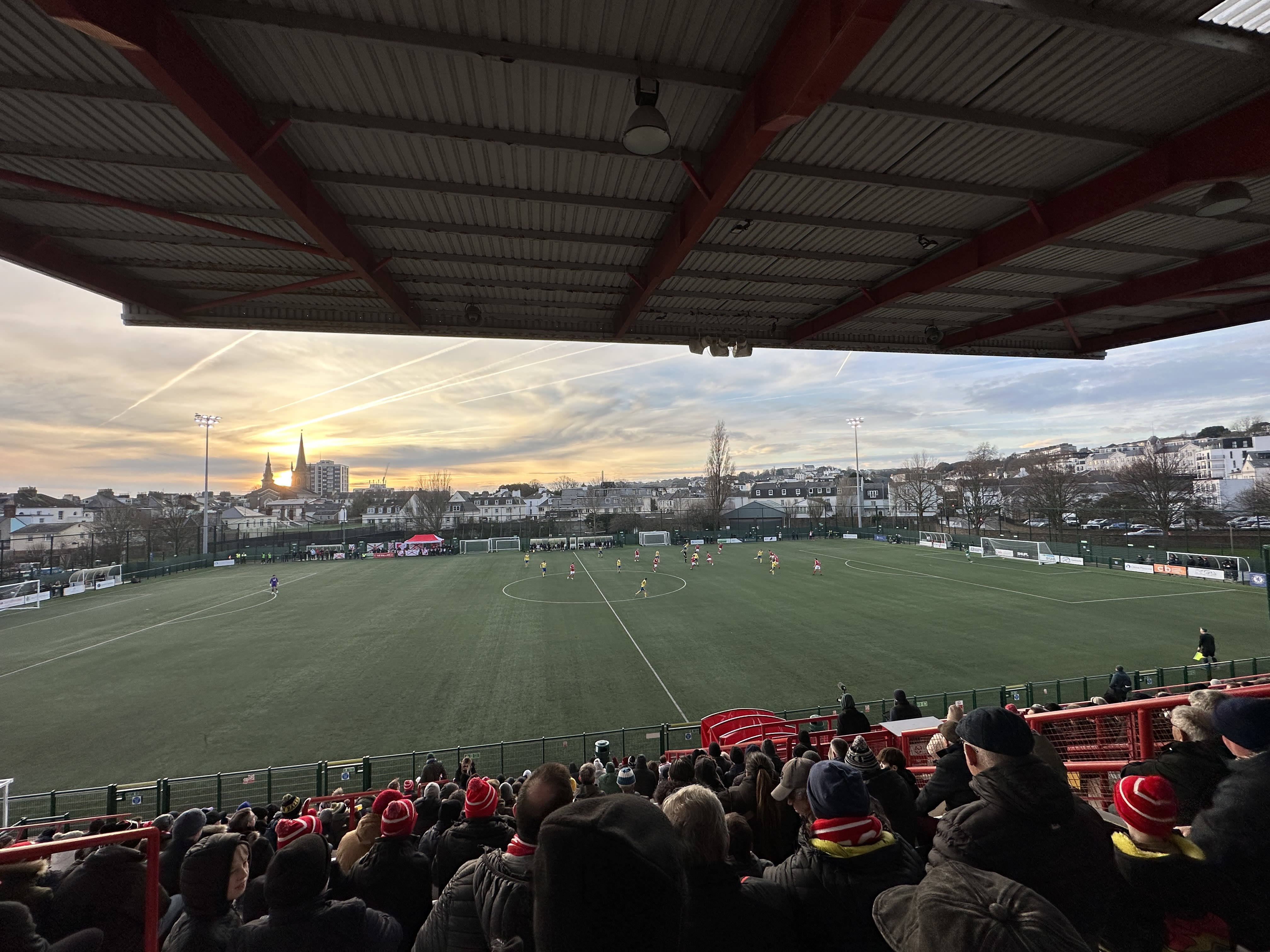 Aerial view of Springfield Stadium during a Jersey Bulls match at sunset.